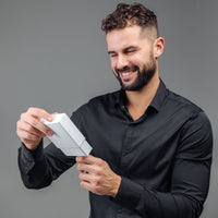 Thumbnail for Man Brown Photo Bracelet gift being unwrapped by a smiling man in a black shirt, showcasing thoughtful design by Brother & Sisters.