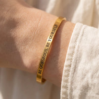 Thumbnail for Close-up of the Be Gorgeous, Be Yourself bracelet in gold worn | SKU: bgby-g