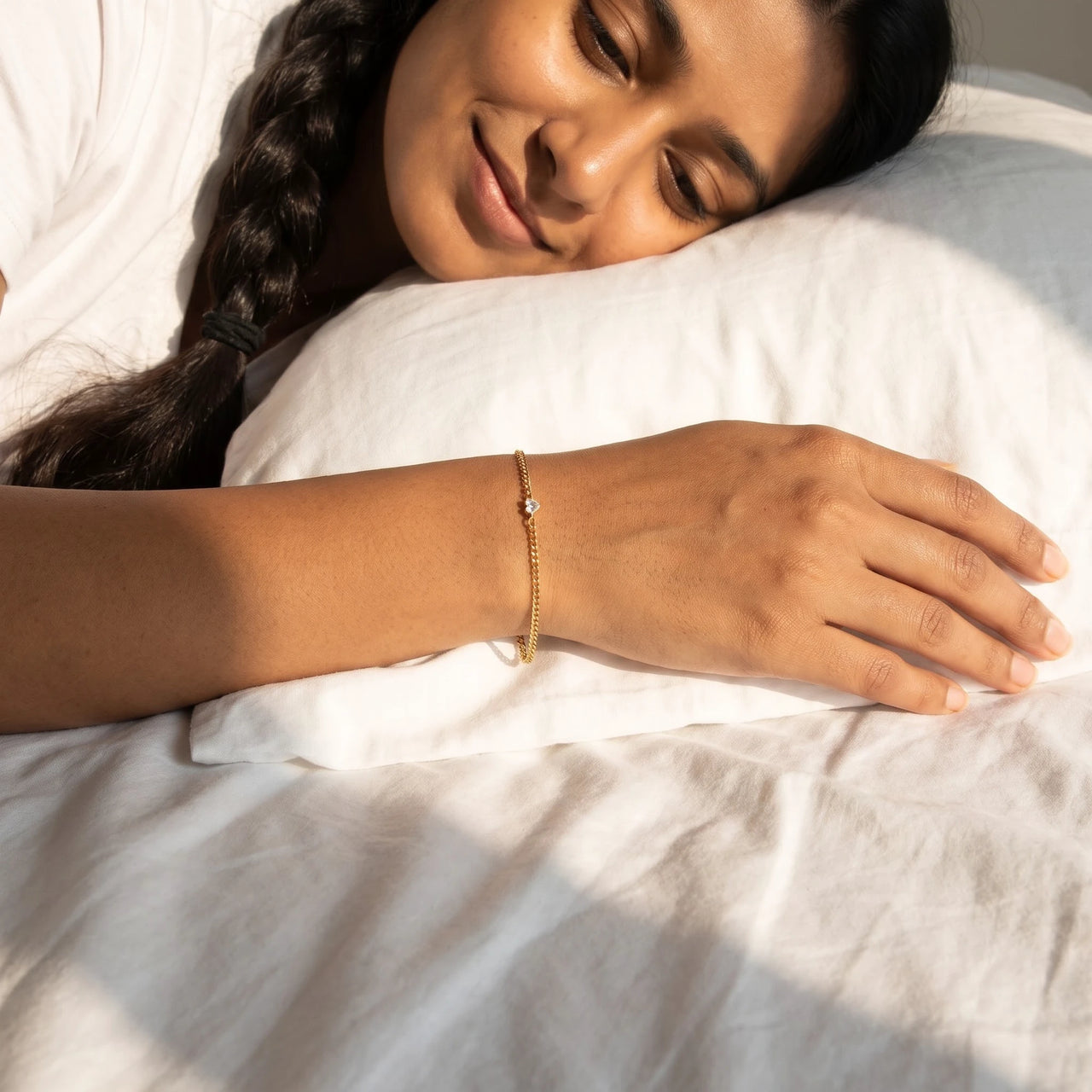 Heart Bond Matching Bracelet Set in Gold — worn on her wrist on a lazy morning in bed