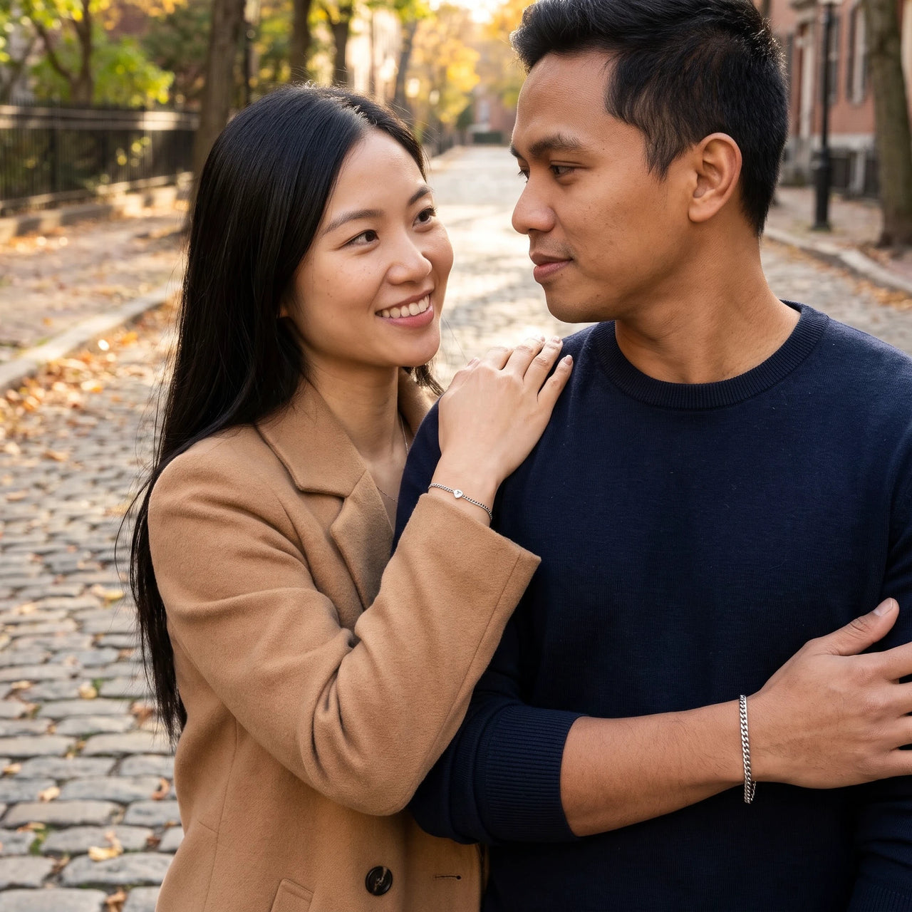 Heart Bond Matching Bracelet Set in Silver — her hand resting on his shoulder, both bracelets visible