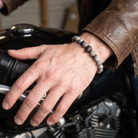 Thumbnail for Black Lion & Grey Stones Bracelet – close-up worn on a man's wrist | Brother & Sisters | SKU: 20866222-gun-black-XS-14-15, 20866222-gun-black-S-16-17, 20866222-gun-black-M-18-19, 20866222-gun-black-L-20-21, 20866222-gun-black-XL-22-23