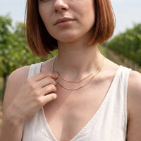 Thumbnail for The Simple, gold necklace — worn gesture | SKU: lesimplenecklace